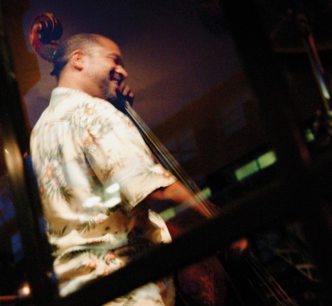 A jazz musician playing an upright bass